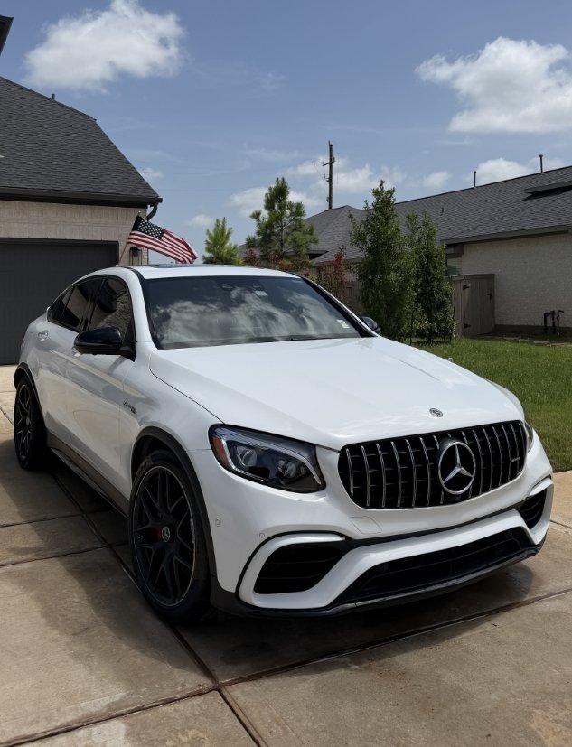 White Mercedes Benz AMG SUV parked after professional auto detailing