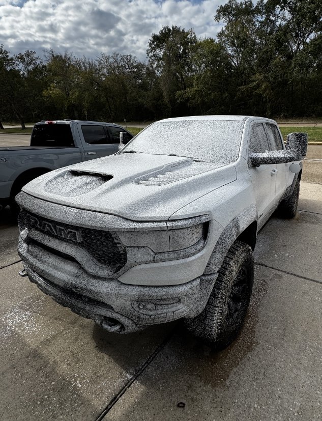 Dodge Ram TRX truck covered in active snow foam during exterior wash